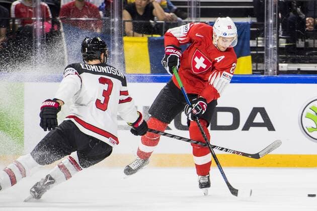 180519 Canadas Joel Edmundson and Switzerland Nino Niederreiter during the semi-finals of the ice hockey World Cup between Canada and Switzerland on May 19, 2018 in Copenhagen  Copyright: PETTERxARVIDSON BB180519PA124
