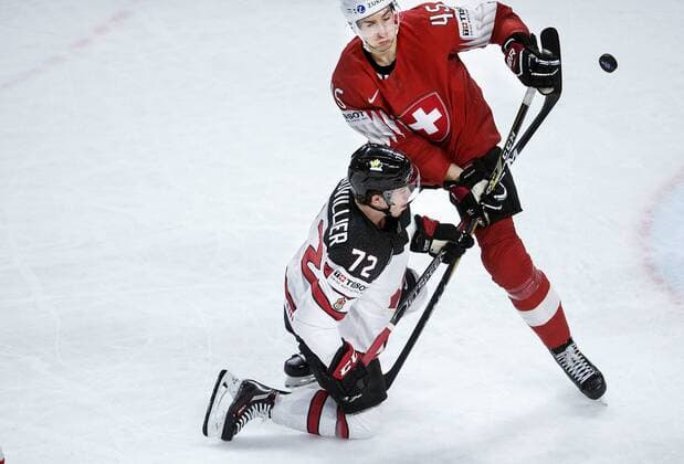 Anthony Beauvillier of Canada and Michael Fora of Switzerland during the IIHF World Championship WM Weltmeisterschaft semi-final Ice hockey Eishockey match between Canada and Switzerland in Royal Arena in Copenhagen, Denmark, Saturday, May 19, 2018.. , Copenhagen Denmark  Copyright: Scanpix LiselottexSabroex COP102 spdk20180519-200016-L