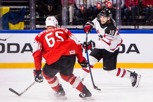 180519 Canada Brayden Schenn tests shot next to Switzerland Ramon Untersander during the semi-finals of the ice hockey World Cup between Canada and Switzerland on May 19, 2018 in Copenhagen  Copyright: PETTERxARVIDSON BB180519PA150