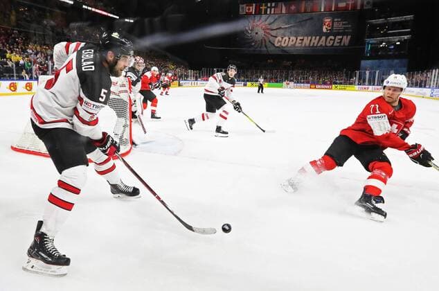 COPENHAGEN, DENMARK - MAY 19, 2018: Canadaâ€™s Aaron Ekblad and Switzerlandâ€™s Enzo Corvi (L-R front) in their 2018 IIHF World Championship WM Weltmeisterschaft semi-final match at Royal Arena in Copenhagen. Alexander Demianchuk TASS  TS080309