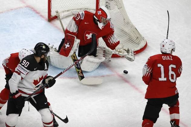 Ice hockey Eishockey - IIHF WC, CAN vs SUI COPENHAGEN,DENMARK,19.MAY.18 - ICE HOCKEY - IIHF World Championships, semifinal, Canada vs Switzerland. Image shows Josi Roman (SUI), Reilly o Ryan (CAN), Leonardo Genoni and Raphael Diaz (SUI). GEPAxpictures xAndreasxPranter