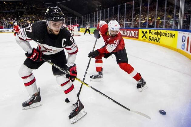 180519 Canadas Connor McDavid and Switzerland Joel Roman during the semi-finals of the ice hockey World Cup between Canada and Switzerland on May 19, 2018 in Copenhagen  Copyright: PETTERxARVIDSON BB180519PA165