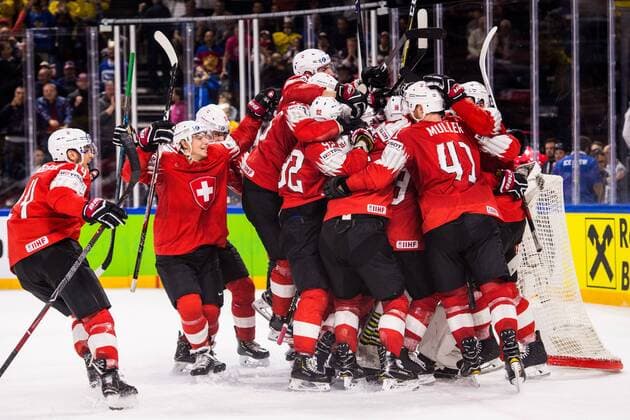 180519 Switzerland players are celebrating the semi-finals of the ice hockey World Cup between Canada and Switzerland on May 19, 2018 in Copenhagen  Copyright: PETTERxARVIDSON BB180519PA167