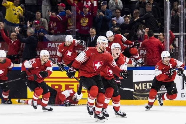 180519 Switzerland players are celebrating the semi-finals of the ice hockey World Cup between Canada and Switzerland on May 19, 2018 in Copenhagen  Copyright: PETTERxARVIDSON BB180519PA172