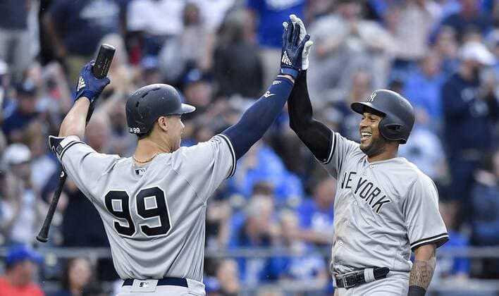 May 19, 2018 - Kansas City, MO, USA - New York Yankees Aaron Hicks is congratulated by Aaron Judge after Hicks hit an in the park home run in the third inning during Saturday s baseball game against the Kansas City Royals on May 19, 2018, at Kauffman Stadium in Kansas City, Mo. Royals vs Yankees - ZUMAm67_ 20180519_zaf_m67_012 Copyright: xJohnxSleezerx