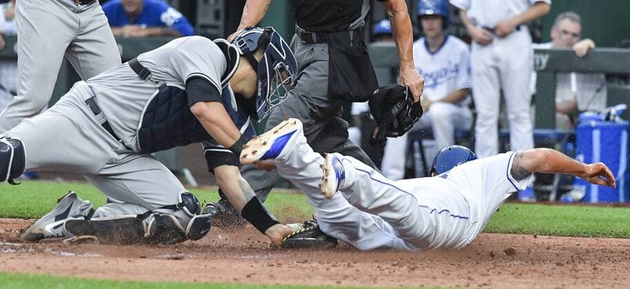 May 19, 2018 - Kansas City, MO, USA - Kansas City Royals Mike Moustakas is tagged out at the plate by New York Yankees catcher Gary Sanchez on a double by Salvador Perez to end the fifth inning during Saturday s baseball gam on May 19, 2018, at Kauffman Stadium in Kansas City, Mo. Royals vs Yankees - ZUMAm67_ 20180519_zaf_m67_024 Copyright: xJohnxSleezerx