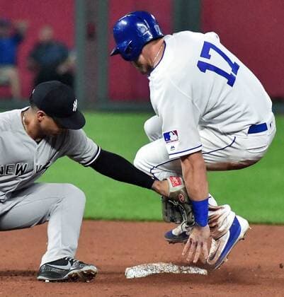 May 19, 2018 - Kansas City, MO, USA - Kansas City Royals Hunter Dozier is tagged out by New York Yankees second baseman Gleyber Torres as he comes off the base trying to steal on a passed ball in the ninth inning during Saturday s baseball game on May 19, 2018, at Kauffman Stadium in Kansas City, Mo. Royals vs Yankees - ZUMAm67_ 20180519_zaf_m67_037 Copyright: xJohnxSleezerx
