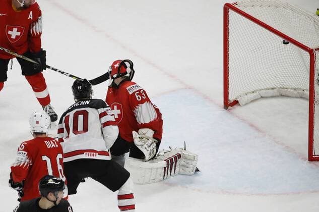 Ice hockey Eishockey - IIHF WC, CAN vs SUI COPENHAGEN,DENMARK,19.MAY.18 - ICE HOCKEY - IIHF World Championships, semifinal, Canada vs Switzerland. Image shows Raphael Diaz (SUI), Brayden Schenn (CAN) and Leonardo Genoni (SUI). GEPAxpictures xAndreasxPranter