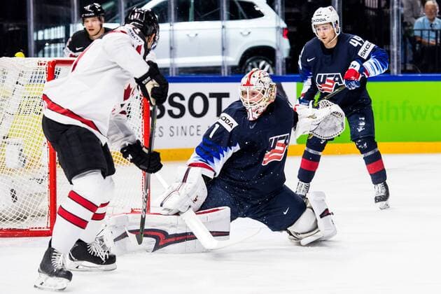 180520 US s maid Keith Kinkaid rescues control of Canadas Tyson Jost during the Bronze match in the ice hockey World Cup between USA and Canada on May 20, 2018 in Copenhagen  Copyright: PETTERxARVIDSON BB180520PA033