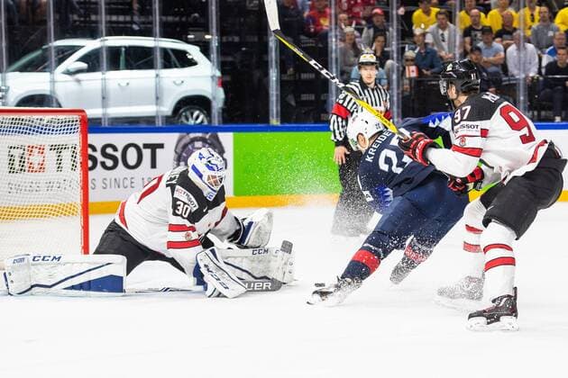 180520 USAs Chris Kreider makes 1 0 painted behind Canadas Marshal Curtis McElhinney during the Bronze Match in the Ice Hockey World Cup between the US and Canada on May 20, 2018 in Copenhagen  Copyright: PETTERxARVIDSON BB180520PA041