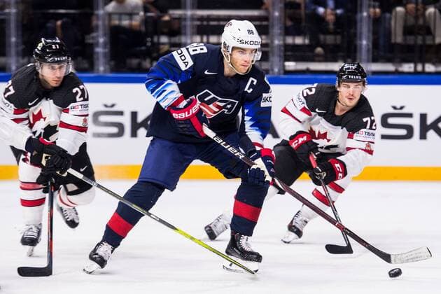 180520 USAs Patrick Kane against Canadas Ryan Murray and Anthony Beauvillier during the Bronze Match in the Ice Hockey World Cup between USA and Canada on May 20, 2018 in Copenhagen  Copyright: PETTERxARVIDSON BB180520PA048