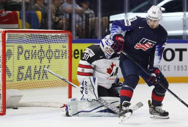 Ice hockey Eishockey - IIHF WC, USA vs CAN COPENHAGEN,DENMARK,20.MAY.18 - ICE HOCKEY - IIHF World Championships, match for third place, USA vs Canada. Image shows Curtis Mcelhinney (CAN) and Chris Kreider (USA). GEPAxpictures xAndreasxPranter