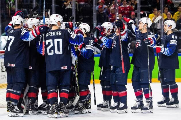 180520 United States players cheer for the win in the bronze match in the ice hockey World Cup between USA and Canada on May 20, 2018 in Copenhagen  Copyright: PETTERxARVIDSON BB180520PA059