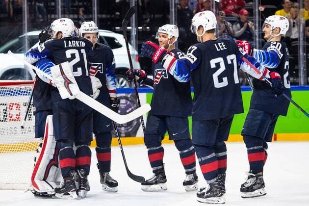 180520 United States players cheer for the win in the bronze match in the ice hockey World Cup between USA and Canada on May 20, 2018 in Copenhagen  Copyright: PETTERxARVIDSON BB180520PA060