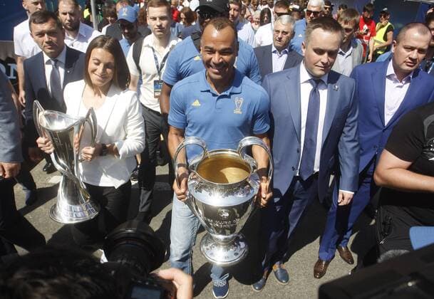 May 24, 2018 - Kiev, Ukraine - CAFU (C), former soccer player of Milan and IYA ANDRUSCHAK (2-L), Ukrainian national soccer player and ambassador for the UEFA Women s Champions League final, walk with the UEFA Champions League trophies during the opening ceremony of a Champions Festival in Kiev, Ukraine, on 24 May, 2018. Real Madrid will face Liverpool FC in the UEFA Champions League final at the NSC Olimpiyskiy stadium in Kiev on 26 May 2018. Real Madrid vs Liverpool FC - ZUMAg194 20180524_zap_g194_009 Copyright: xSergxGlovnyx