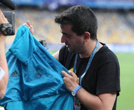 Real Madrid Training Spanish cameraman Lorenzana Prieto of Univision Deportes Network (USA) had his camera hit by a wild shot from Cristiano Ronaldo of Real Madrid which in turn hit him in the face causing a deep cut over his right eye. The Real Madrid star then sent his training top via a member of the backrooom team over to Lorenzana and waved an apology during the Real Madrid training session at the Olympic Stadium, Kiev Content Not Available For UK Newspapers Copyright: xPaulxChestertonx FIL-11836-0009