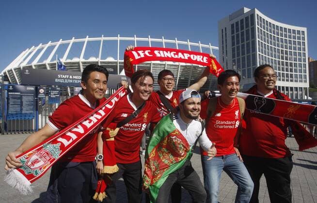 May 26, 2018 - Kiev, Ukraine - Liverpool fans pose for a photo in front of the NSC Olimpiyskiy stadium in Kiev, Ukraine, 26 May 2018. Real Madrid will face Liverpool FC in the UEFA Champions League final at the NSC Olimpiyskiy stadium on 26 May 2018. Real Madrid vs Liverpool FC, UEFA Champions League final - ZUMAg194 20180526_zap_g194_001 Copyright: xSergxGlovnyx