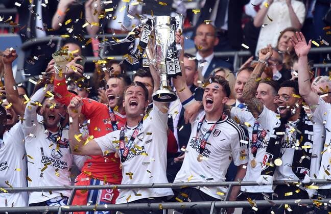 Themen der Woche - SPORT KW21 Bilder des Tages - SPORT Tom Cairney of Fulham and Kevin McDonald of Fulham celebrate with the cup at the end of the championship playoff final match at Wembley Stadium, London. Picture date 26th May 2018. Picture credit should read: Robin Parker Sportimage EDITORIAL USE ONLY. No use with unauthorised audio, video, data, fixture lists, club league logos or live services. Online in-match use limited to 120 images, no video emulation. No use in betting, games or single club league player publications. RP1_6516.JPG