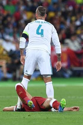Football Champions League Final Real Madrid Liverpool on 26 05 2018 at the Olympic Stadium in Kiev Mohamed Salah Liverpool injured on the ground Sergio Ramos Madrid behind xRx