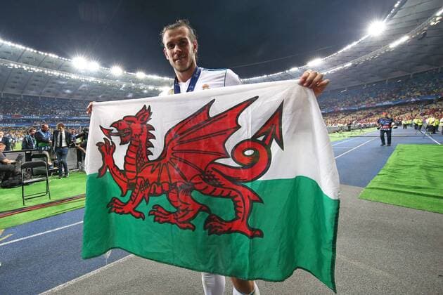 Real Madrid v Liverpool UEFA Champions League Final Gareth Bale of Real Madrid with the Welsh flag at the end of the UEFA Champions League Final at the Olympic Stadium, Kiev Content Not Available For UK Newspapers Copyright: xPaulxChestertonx FIL-11844-0058