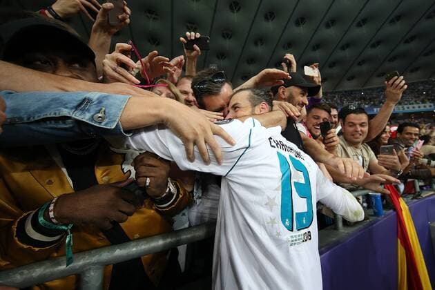 Real Madrid v Liverpool UEFA Champions League Final Gareth Bale of Real Madrid celebrates victory with the Real Madrid fans at the end of the UEFA Champions League Final at the Olympic Stadium, Kiev Content Not Available For UK Newspapers Copyright: xPaulxChestertonx FIL-11844-0069