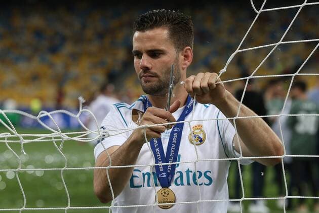 Real Madrid v Liverpool UEFA Champions League Final Nacho Fernandez of Real Madrid cuts the net at the end of the UEFA Champions League Final at the Olympic Stadium, Kiev Content Not Available For UK Newspapers Copyright: xPaulxChestertonx FIL-11844-0215