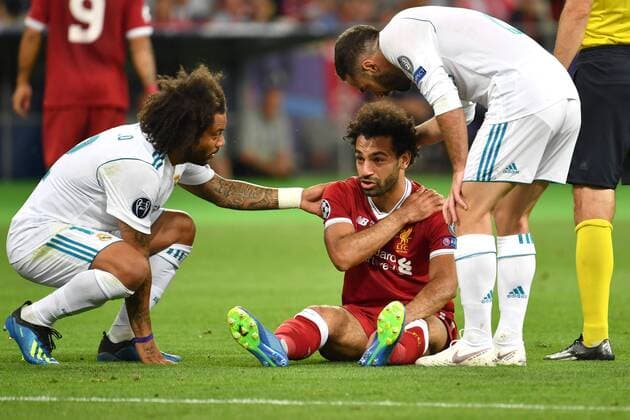 Marcelo da Silva Junior Real Madrid and Sergio Ramos Real Madrid troesten Mohamed SALAH Liverpool injured sitting on the grass injury disappointed frustrated dejected Football Champions League Final 2018 Real Madrid Liverpool 3 1 Season2017 18 at 26 05 2018 Stadium NSK Olimpiyskyi