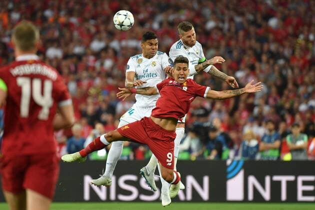 Roberto FIRMINO Liverpool action duel air combat against CASEMIRO Real Madrid li and Sergio Ramos Real Madrid header Football Champions League Final 2018 Real Madrid Liverpool 3 1 season2017 18 at 26 05 2018 stadium NSK Olimpiyskyi