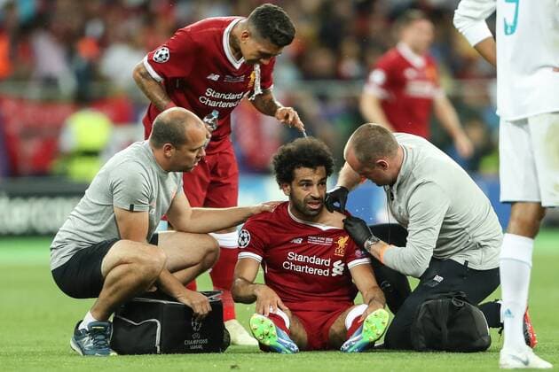 (180527) -- KIEV, May 27, 2018 -- Mohamed Salah of Liverpool receives medical treatment during the UEFA Champions League final match between Liverpool and Real Madrid in Kiev, Ukraine on May 26, 2018. Real Madrid claimed the title with 3-1. ) (SP)UKRAINE-KIEV-CHAMPIONS LEAGUE-LIVERPOOL-REAL MADRID Wuzhuang 