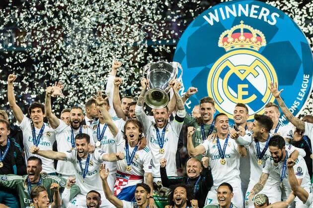 (180527) -- KIEV, May 27, 2018 -- Sergio Ramos (C) of Real Madrid holds the trophy after winning the UEFA Champions League final match between Liverpool and Real Madrid in Kiev, Ukraine on May 26, 2018. Real Madrid claimed the title with 3-1. ) (SP)UKRAINE-KIEV-CHAMPIONS LEAGUE-LIVERPOOL-REAL MADRID Wuzhuang 