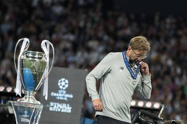 (180527) -- KIEV, May 27, 2018 -- Liverpool s coach Jurgen Klopp walks past the trophy after the UEFA Champions League final match between Liverpool and Real Madrid in Kiev, Ukraine on May 26, 2018. Real Madrid claimed the title with 3-1. ) (SP)UKRAINE-KIEV-CHAMPIONS LEAGUE-LIVERPOOL-REAL MADRID WuxZhuang 