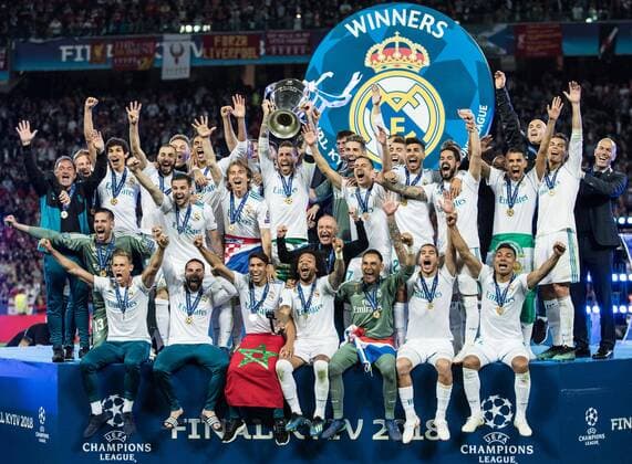 (180527) -- KIEV, May 27, 2018 -- Sergio Ramos (C) of Real Madrid holds the trophy after the UEFA Champions League final match between Liverpool and Real Madrid in Kiev, Ukraine on May 26, 2018. Real Madrid claimed the title with 3-1. ) (SP)UKRAINE-KIEV-CHAMPIONS LEAGUE-LIVERPOOL-REAL MADRID WuxZhuang 