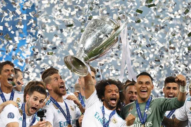(180527) -- KIEV, May 27, 2018 -- Marcelo (C) of Real Madrid holds the trophy after the UEFA Champions League final match between Liverpool and Real Madrid in Kiev, Ukraine on May 26, 2018. Real Madrid claimed the title with 3-1. ) (SP)UKRAINE-KIEV-CHAMPIONS LEAGUE-LIVERPOOL-REAL MADRID Sergey 