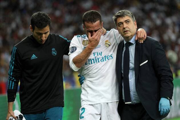 May 26, 2018 - Kiev, Ukraine - Real Madrid s Dani Carvajal, in the center, leaves the field with medics during the final match of the Champions League between Real Madrid and Liverpool at the Olympic Stadium in Kiev. Ukraine, Saturday, May 26, 2018 Real Madrid v Liverpool - UEFA Champions League Final  - ZUMAn230 20180526_zaa_n230_1336 Copyright: xDanilxShamkinx