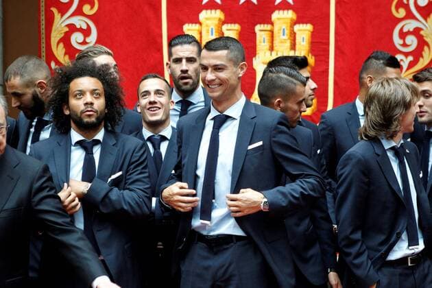 Real Madrid s players Cristiano Ronaldo (C) and Marcelo Vieira (L) attend a reception at the Madrid regional government s headquarter in Madrid, Spain, 27 May 2018. Real Madrid defeated 3-1 Liverpool in the UEFA Champions League final at the NSC Olimpiyskiy stadium in Kiev on 26 May 2018. Real Madrid celebration in Madrid !ACHTUNG: NUR REDAKTIONELLE NUTZUNG!  Copyright: xVictorxLerenax GRAF7188 20180527-636630533029003075