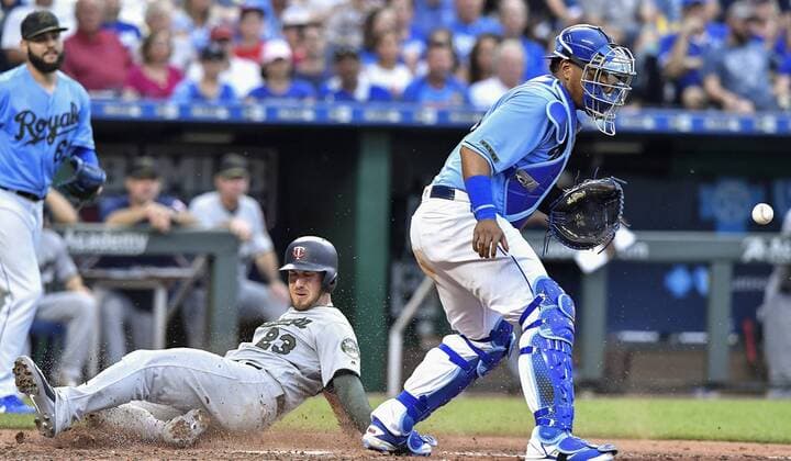 May 28, 2018 - Kansas City, MO, USA - Minnesota Twins Mitch Garver scores behind Kansas City Royals catcher Salvador Perez on a single by Brian Dozier in the sixth inning during Monday s baseball game on May 28, 2018, at Kauffman Stadium in Kansas City, Mo. Twins vs Royals - ZUMAm67_ 20180528_zaf_m67_023 Copyright: xJohnxSleezerx