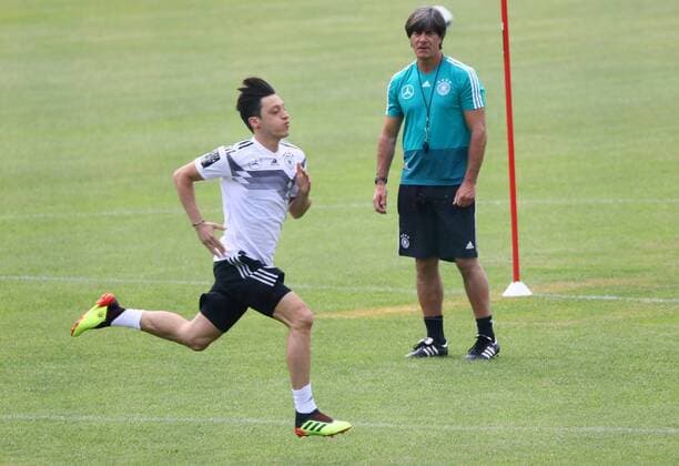 National coach Joachim Loew Germany Germany sees Mesut Oezil Germany Germany running 29 05 2018 Training of the German national team for the World Cup Preparation in the sports zone Rungg in Eppan South Tyrol