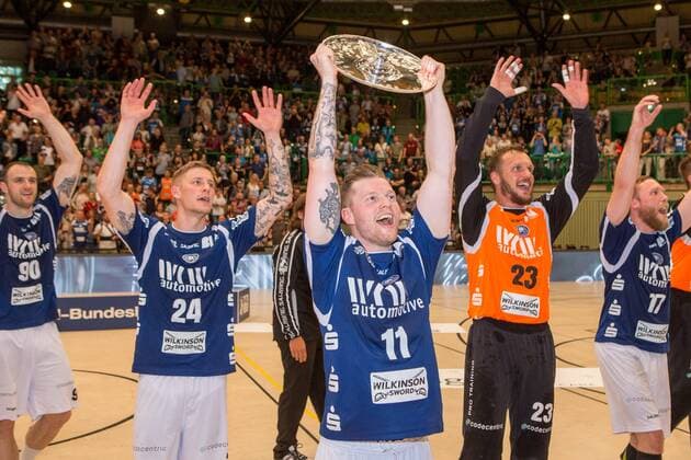 Arnor Thor Gunnarsson 11 Bergischer HC in front of Linus Arnesson 24 Bergisch HC Bastian Rutschmann 23 Bergischer HC and Jan Artmann 17 Bergischer HC with the championship cup of the 2 Handball Bundesliga Bergischer HC vs HSC Coburg 2000 Handball 2 Handball Bundesliga 02 06 18 Wuppertal NRW Germany Uni Halle Copyright: xcdnx