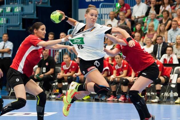 Emily Bölk No. 19 Germany in attack is tried by Nurceren Akgün Göktepe No. 14 Turkey and Beyzma Irem Türkoglu No. 27 Turkey right on the throw to prevent Germany vs Turkey Handball EC Qualification Women 02 06 18 Gummersbach NRW Germany Schwalbe Arena Copyright: xcdn_nszx