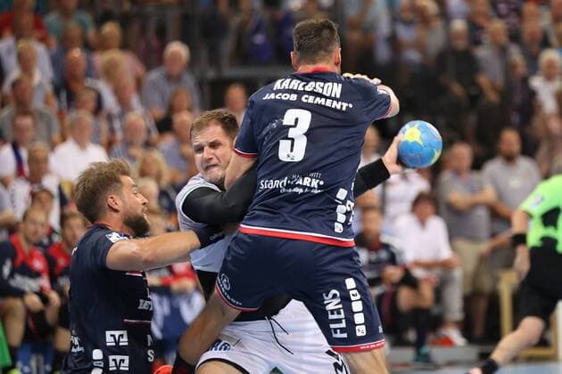 Kresimir Kozina Frisch on Goeppingen 44 against Tobias Karlsson SG Flensburg Handewitt 03 and Jacob Heinl SG Flensburg Handewitt 21 Flensburg Schleswig Holstein Germany Flens Arena Copyright: xAgentur54Gradx xSpeedphotosx