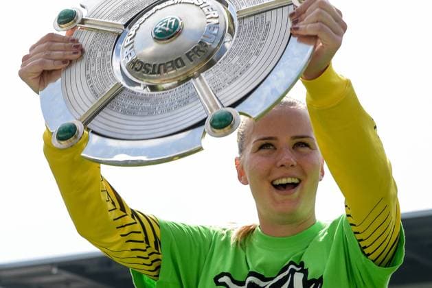 Merle Frohms goalkeeper Wolfsburg shows the championship cup cheers after the final whistle victory winner winner cheers cheer joy optimistic Action Action Soccer Allianz Women Bundesliga VfL Wolfsburg 1 FC Cologne xmhx