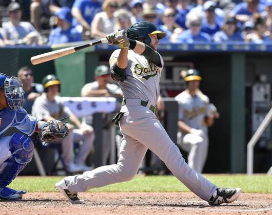June 3, 2018 - Kansas City, MO, USA - Oakland Athletics Jed Lowrie follows through on an RBI single in the eighth inning to score Dustin Fowler from second against the Kansas City Royals on Sunday, June 3, 2018, at Kauffman Stadium in Kansas City, Mo. Oakland Athletics vs. Kansas City Royals - ZUMAm67_ 20180603_zaf_m67_028 Copyright: xJohnxSleezerx