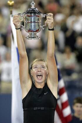 - NEW YORK, USA : Maria Sharapova of Russia celebrates with her trophy after defeating Belgian Justine Henin-Hardenne in the women final match at the US Open Tennis tournament, Saturday 09 September 2006, in Flushing Meadows, New York. Sharapova won 6-4, 6-4. DIDIERxMOSSIAT  x5014122x
