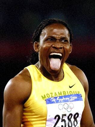 SYD14--SYDNEY,AUSTRALIA: ATHLETICS, TRACK AND FIELD: Maria Mutola of Mozambique exclaims her joy by sticking her tongue out as she wins the gold medal on the women s 800M in 1: 56.15. Mutola won for Mozambique the first golden medal since the existence of the Olympic Games Olympische Spiele Olympia OS PHOTO BELGA REPORTERS NO USE BY LLB, DH, VERS L AVENIR PHILIPPExBUISSIN  x513387x