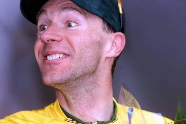 NO MAGS-NO SALES-NO INTERNET BRU19 - - COLMAR, FRANCE : German Jens Voigt of the Credit Agricole team smiles on the podium of the 7th stage of the 88th Tour de France in Colmar 14 July 2001. French Laurent Jalabert leader of the CSC-Tiscali won the stage and Voigt takes the yellow jersey. MICHELxGOUVERNEUR  x673612x