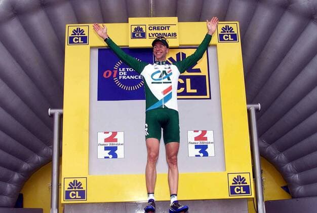 NO MAGS-NO SALES-NO INTERNET BRU53 - - COLMAR, FRANCE : German Jens Voigt of the Credit Agricole team smiles on the podium of the 7th stage of the 88th Tour de France in Colmar 14 July 2001. French Laurent Jalabert leader of the CSC-Tiscali won the stage and Voigt takes the yellow jersey. MICHELxGOUVERNEUR  x673844x