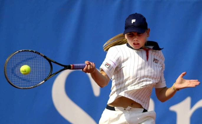 BRU92 - - KNOKKE, BELGIUM: Yugoslavian tennis player Jelena Dokic returns a ball during her match against Czech Denisa Chladkova in the first round of the Sanex Tennis Trophy WTA Tennis Damen tournament in Knokke, Monday 16 July 2001. YVESxBOUCAU  x674575x