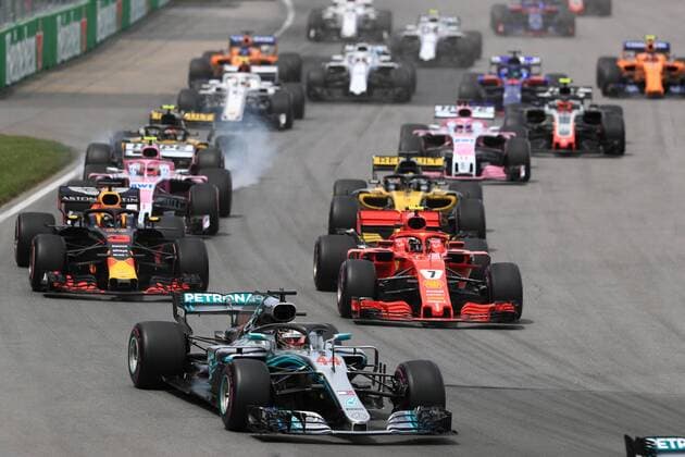 10th June 2018, Circuit Gilles-Villeneuve, Montreal, Canada; Canadian Formula One Grand Prix, race day; Scuderia Ferrari; Kimi Raikkonen runs behind Hamilton in 1st corner  ActionPlus12035536 Octane