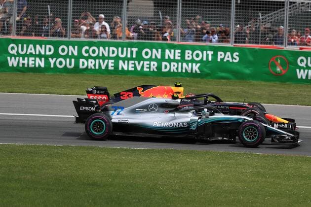10th June 2018, Circuit Gilles-Villeneuve, Montreal, Canada; Canadian Formula One Grand Prix, race day; Mercedes AMG Petronas Motorsport; Valtteri Bottas and Aston Martin Red Bull Racing TAG Heuer Max Verstappen side by side in first 2 corners  ActionPlus12035539 Octane