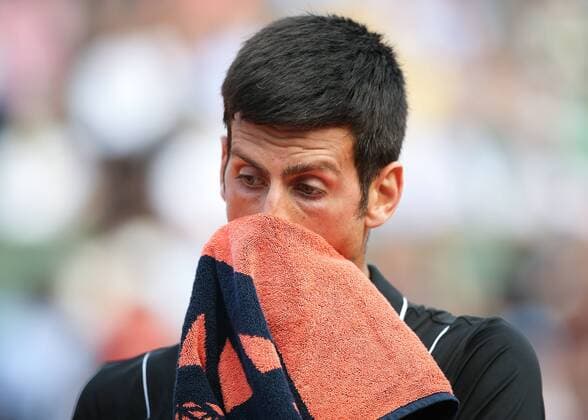NOVAK DJOKOVIC SRB with towel in front of face disappointment frustration Copyright: xJuergenxHasenkopfx